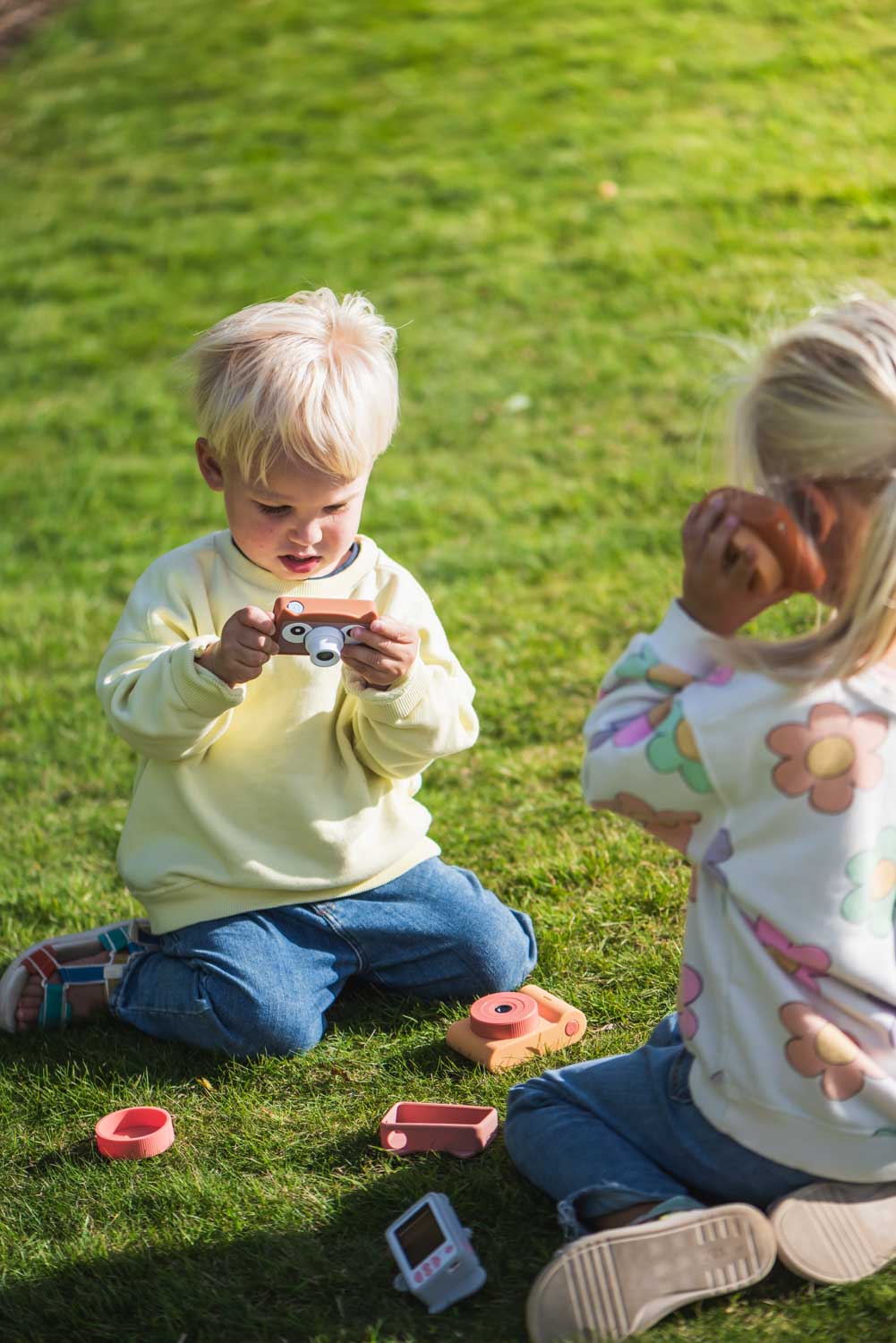 owl digital kids camera, children are playing in the garden with the camera and walki talki