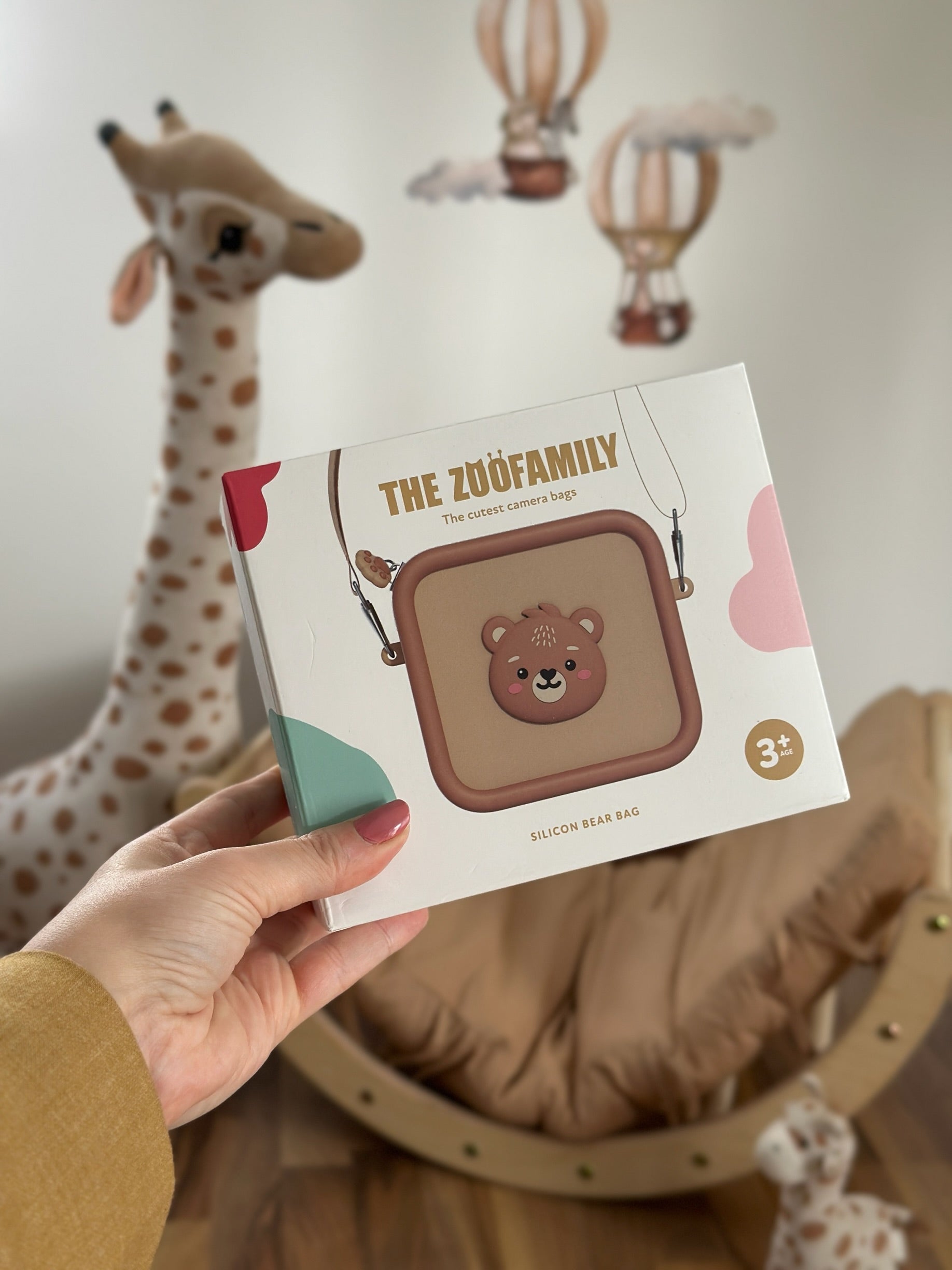 'The Zoo Family' product packaging with a bear design.