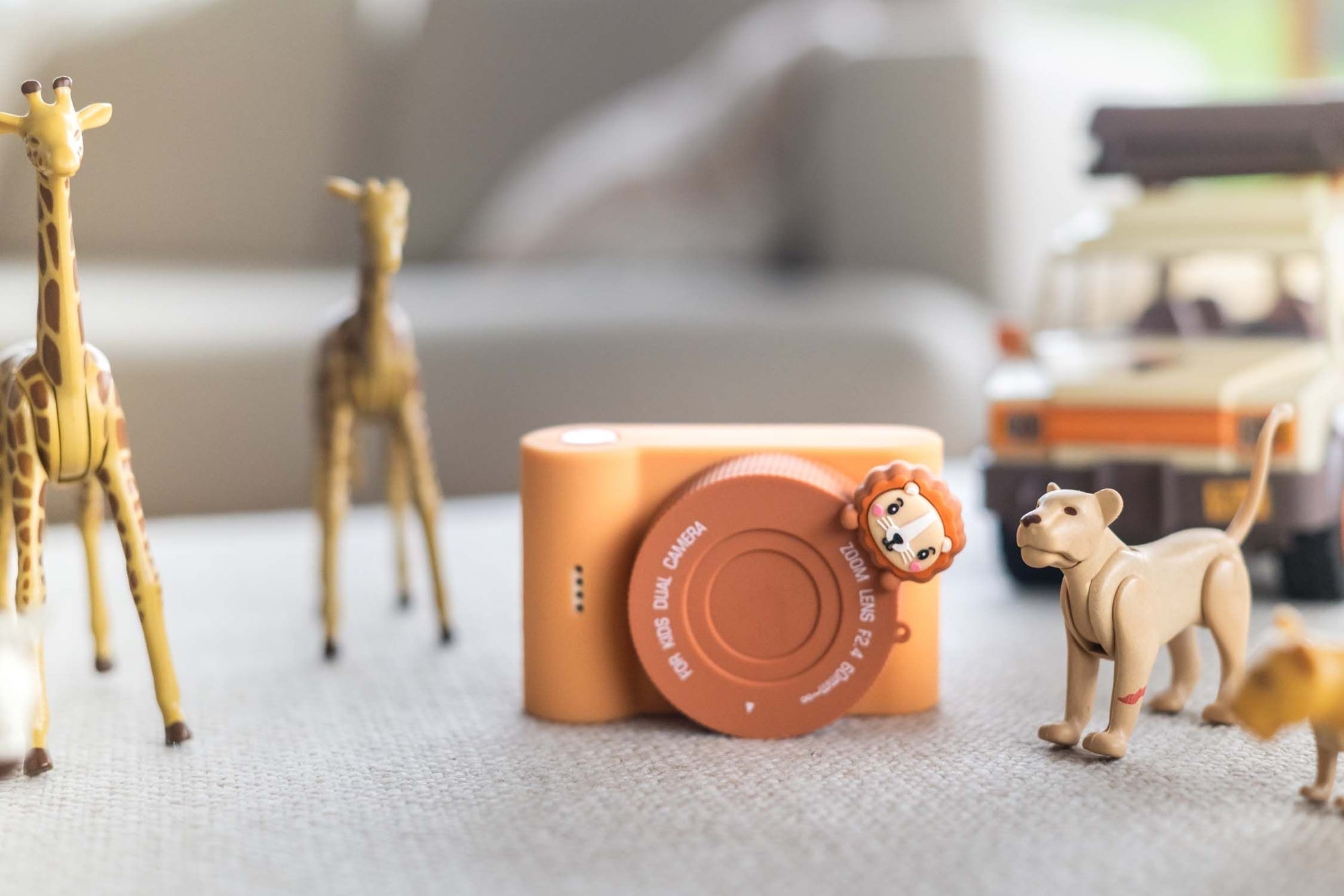urban zoo lion digital kids camera, standing between animal toys