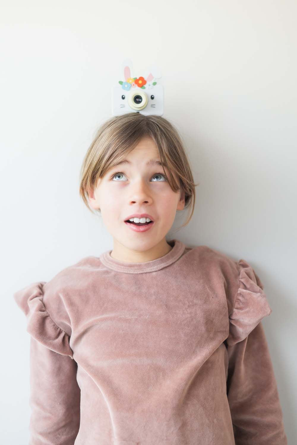 zoo friends rabbit flower digital kids camera, child is holding the camera on its head