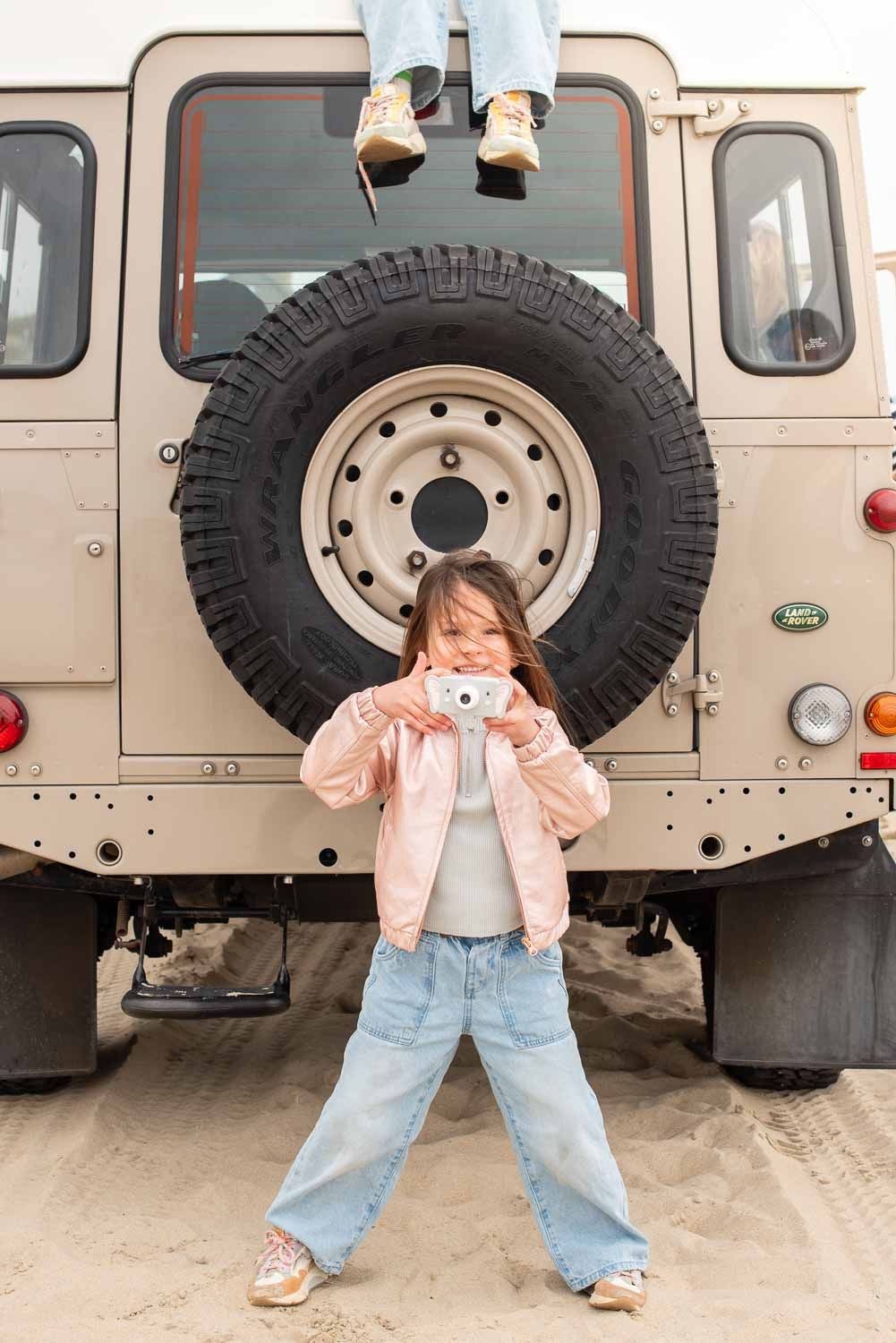 zoo friends elephant digital kids camera, child is holding the camera while standing at the back of a jeep