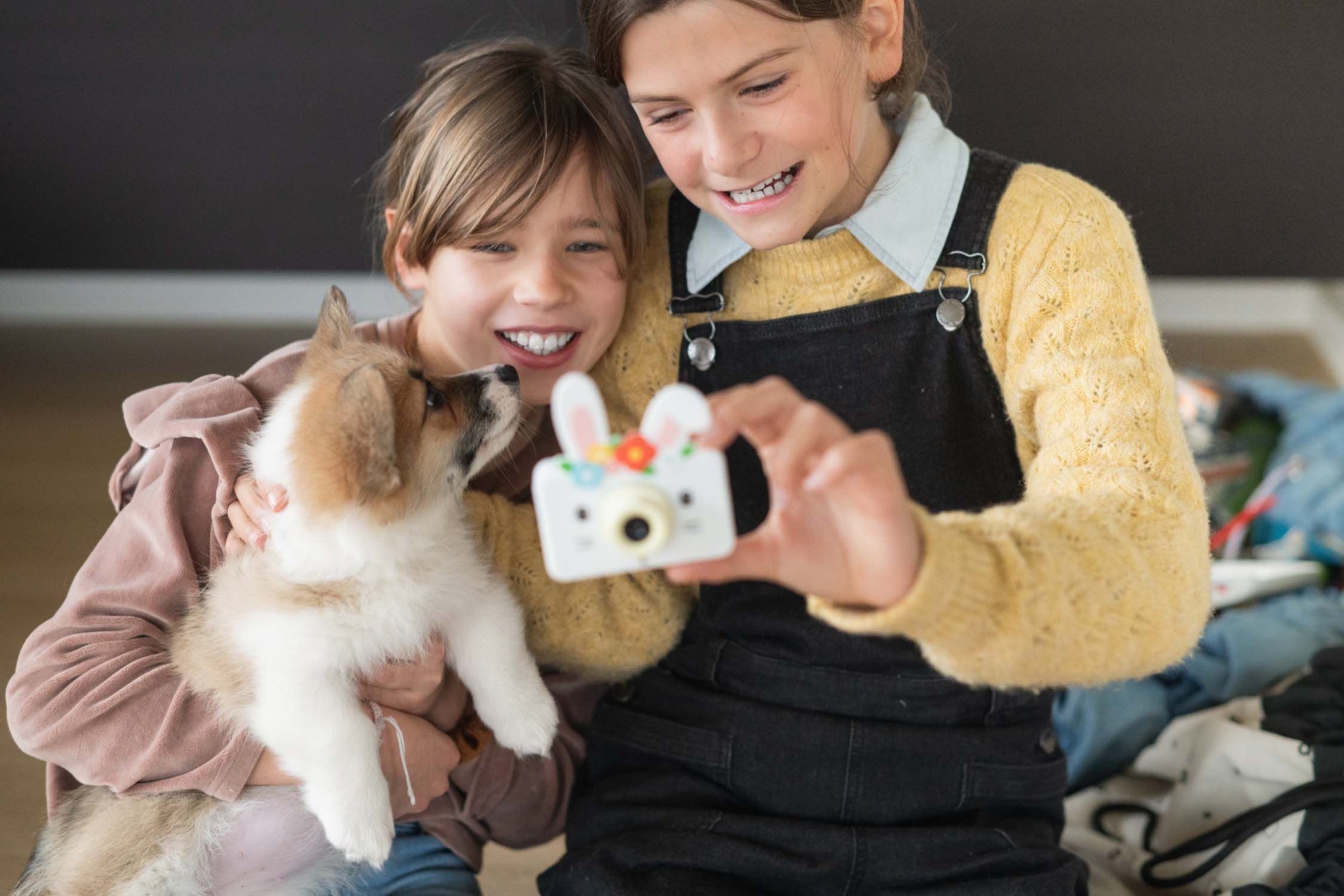 zoo friends rabbit flower digital kids camera, children are taking a selfie while holding the dog