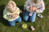 odalowl digital kids camera, children sitting outside while playing with the cameras and walki talki