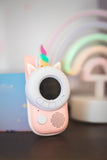 odalzoo walkie talkie unicorn, standing in front of rainbow