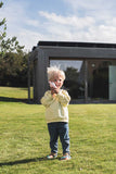 odalzoo walkie talkie unicorn, child in standing outside while holding the walkie talkie