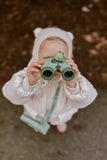 odalA girl is looking through binoculars.