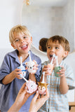 odalHappy children with different toothbrushes.