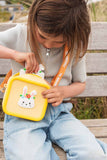 odalsilicon bag rabbit flower, child is carrying the bag over its shoulder while placing the rabbit camera into the bag