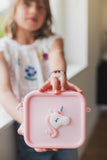 odalUnicorn Bag for pink Periwinkle the Unicorn digital kids camera, child is showing the bag