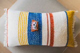 odalblue digital kids camera with owl sleeve, camera is lying on a pillow
