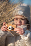 odalzoo friends bear digital kids camera, child is holding the camera while taking pictures at the beach