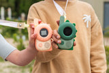 odalzoo walkie talkie set dino green and pink, children are showing the walkie talkies