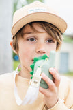 odalzoo walkie talkie dino green, child is having it around its neck while speaking into it