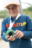 odalzoo walkie talkie dino green, child is having fun with its walkie talkie