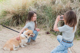 odalurban zoo unicorn digital kids camera, child is holding the dog while another child is taking a picture