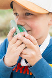 odalzoo walkie talkie dino green, close up of child who is speaking into the walkie talkie