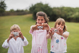 odalmix of owl, cat and elefant kids digital cameras, kids are standing in the garde, showing the cameras