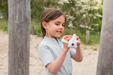 odalzoo video unicorn digital kids camera, child is holding the camera while standing outside 