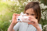 odalzoo video unicorn digital kids camera, child is making a movie with its camera, outside