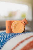 odalurban zoo bear digital kids camera, lenscover, camera is standing on a pillow