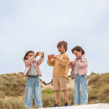 odalzoo friends giraffe and elephant digital kids camera and urban fox camera, children are holding the cameras while standing at the beach