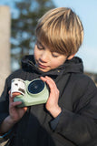 odalzoo print dino green digital kids camera, child is printing out a taken picture