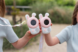 odalwalkie talkie rabbit set, children are holding the walkie talkies next to each other