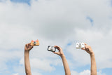 odalfjox, penguin and unicorn kids cameras, children holding them in the air