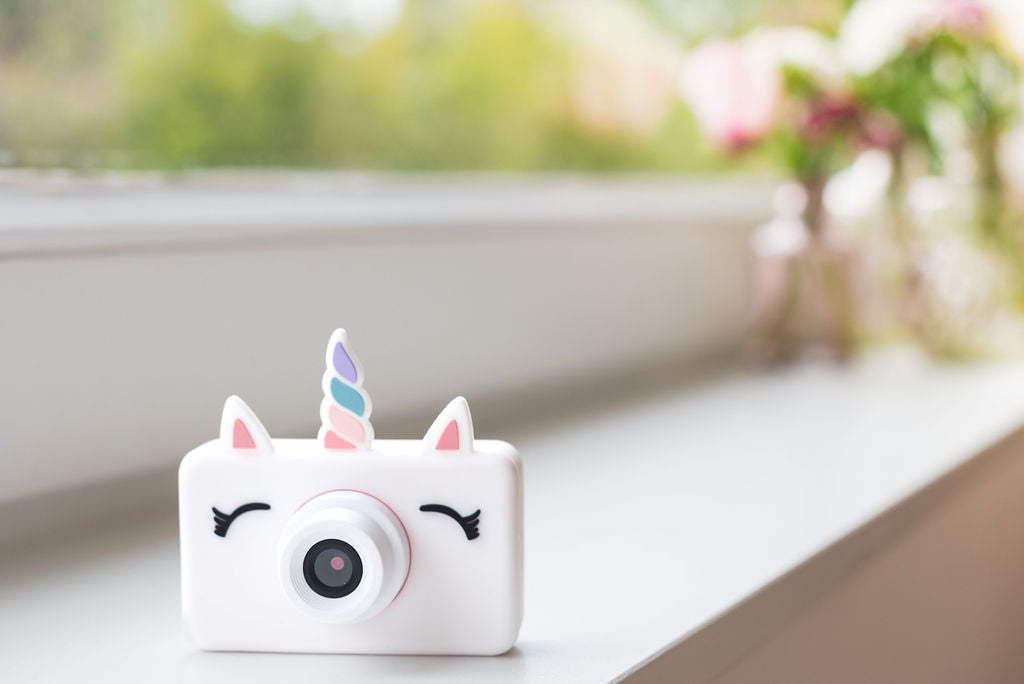 unicorn kids camera, standing on window sill