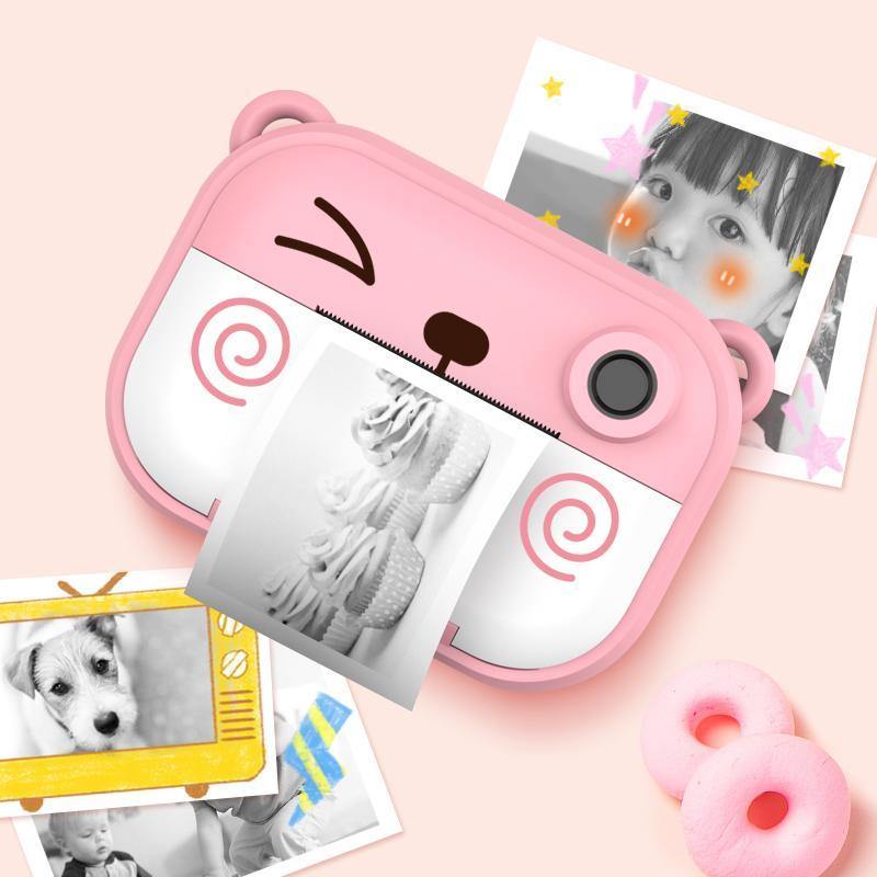 pink camera that prints pictures